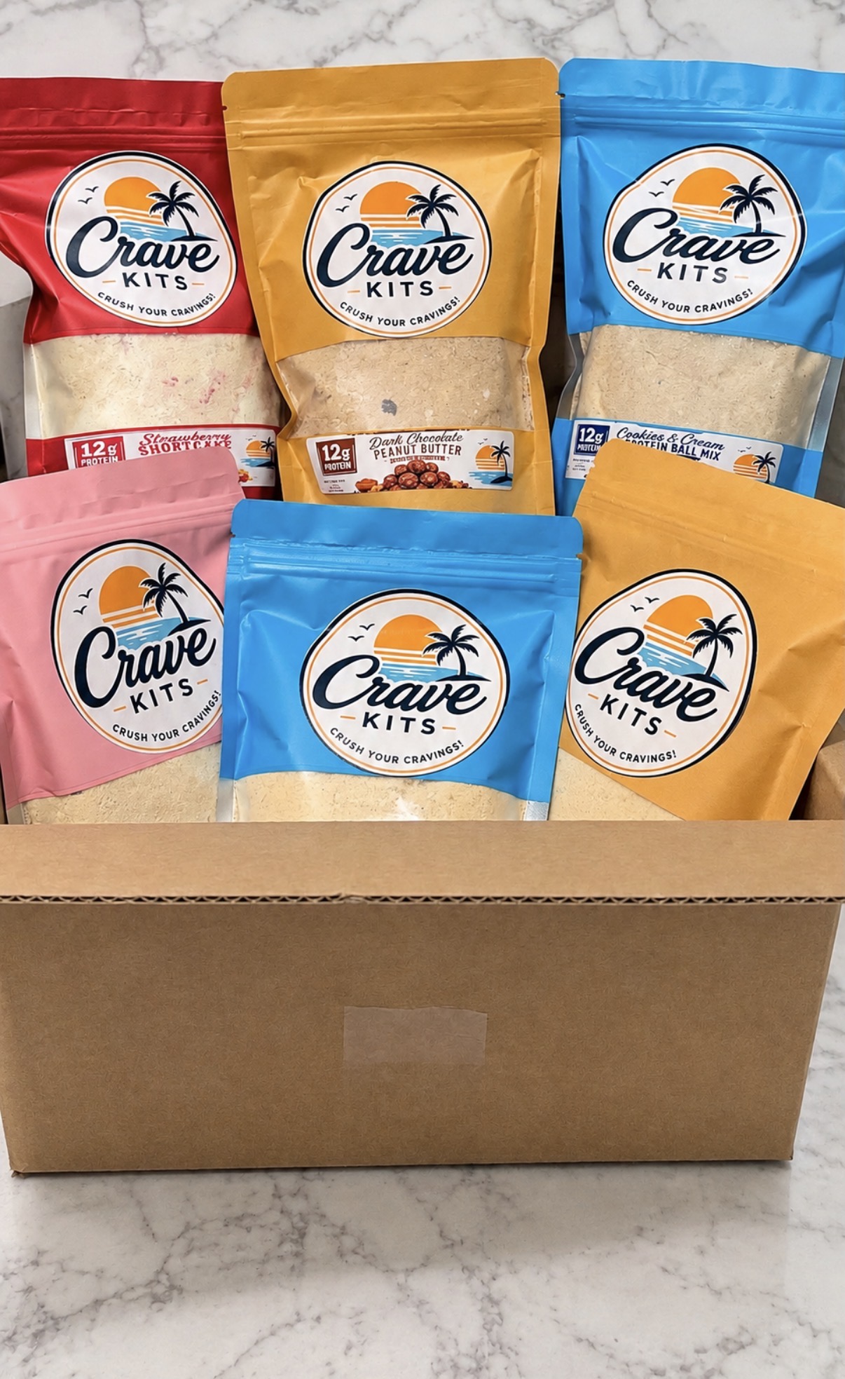 A Crave Kits box filled with every protein ball flavor — pick your own mix